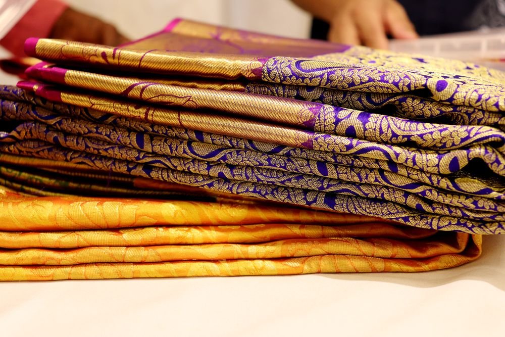 Folded silk sarees with woven borders